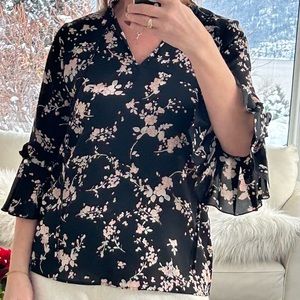 Women’s blouse with pearl detail on sleeves